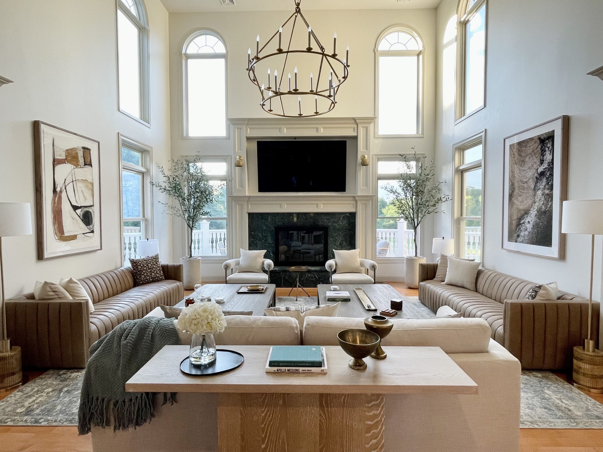 The great room at Rhinebrook Estate with fireplace and valley views